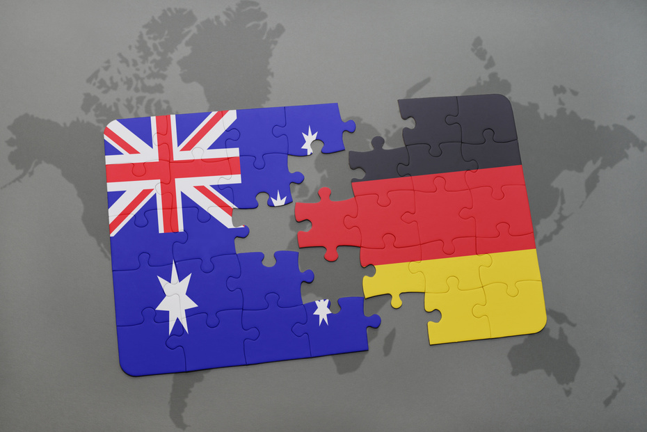 Puzzlestück aus den Fahnen Australiens und Deutschlands
